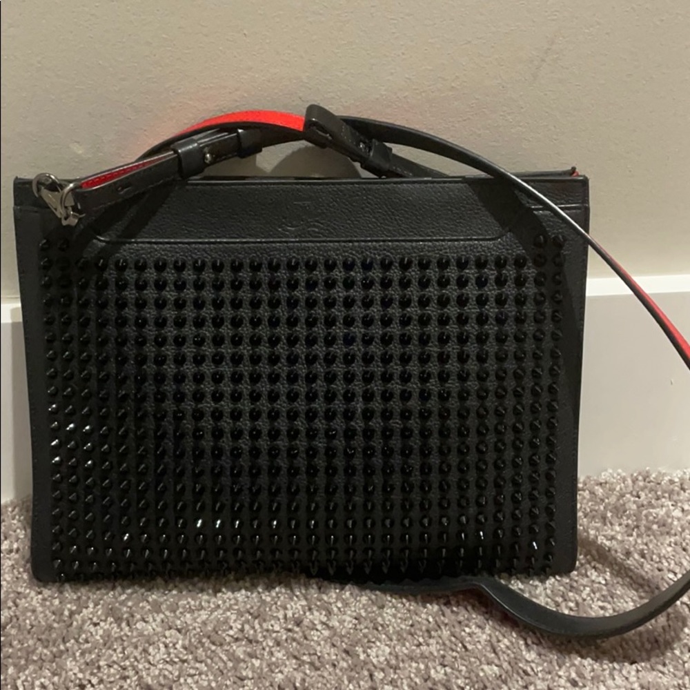 Cross body spiked hand bag